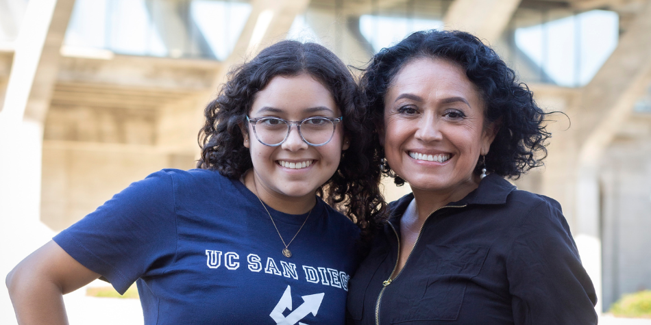 UC San Diego student and their mom smiling for the camera
